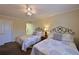 Two twin beds in a sunny guest bedroom with ensuite bathroom access at 315 30Th W Ave # B311, Bradenton, FL 34205