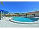 Inviting kidney shaped community pool with ample seating at 315 30Th W Ave # B311, Bradenton, FL 34205