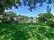 Landscaped grounds with gazebo, grill, and scenic lake views at 315 30Th W Ave # B311, Bradenton, FL 34205