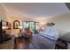 Cozy living room featuring a cream sofa, and a balcony entrance at 315 30Th W Ave # B311, Bradenton, FL 34205