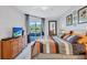 Main bedroom with king bed and sliding doors leading to the pool area at 335 River Enclave Ct, Bradenton, FL 34212