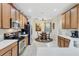 Eat-in kitchen with wood cabinets and a breakfast nook at 335 River Enclave Ct, Bradenton, FL 34212