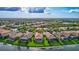 Aerial view of single Gathering home in a quiet residential neighborhood at 335 River Enclave Ct, Bradenton, FL 34212