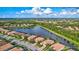 Aerial view of house on the lake in a residential neighborhood at 335 River Enclave Ct, Bradenton, FL 34212
