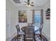 Bright dining area with a round table, four chairs, and a ceiling fan at 335 River Enclave Ct, Bradenton, FL 34212