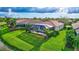 Private pool and lanai area with lush landscaping at 335 River Enclave Ct, Bradenton, FL 34212