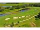 Aerial view of the golf course with water features at 335 River Enclave Ct, Bradenton, FL 34212