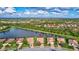 Aerial view of a house community with lake access at 335 River Enclave Ct, Bradenton, FL 34212