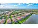 Aerial view of single Gathering home with backyard access to lake at 335 River Enclave Ct, Bradenton, FL 34212