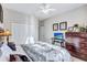 Bright bedroom with a ceiling fan and ample closet space at 335 River Enclave Ct, Bradenton, FL 34212