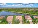 Aerial view of houses with screened lanais in a neighborhood at 335 River Enclave Ct, Bradenton, FL 34212