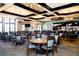 Clubhouse dining area with tables, chairs, and bar at 335 River Enclave Ct, Bradenton, FL 34212