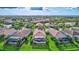 Aerial view of houses with pools in a neighborhood at 335 River Enclave Ct, Bradenton, FL 34212