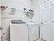 Convenient laundry room with washer, dryer, and shelving at 335 River Enclave Ct, Bradenton, FL 34212