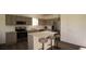 Modern kitchen with stainless steel appliances and an island at 4605 Boxelder Avenue, Parrish, FL 34219
