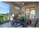 Covered patio with outdoor kitchen and dining area at 4612 Stickley Ct, Palmetto, FL 34221