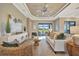 Relaxing living area with comfy seating, large windows, and stylish decor at 4612 Stickley Ct, Palmetto, FL 34221