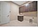 Laundry room with cabinets and sink at 4612 Stickley Ct, Palmetto, FL 34221