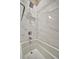 Bathroom featuring a bathtub with marble tile surround and rain shower head at 4612 Stickley Ct, Palmetto, FL 34221