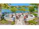 Stone fire pit with seating area, perfect for gatherings at 4612 Stickley Ct, Palmetto, FL 34221