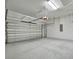 Garage with overhead storage and epoxy flooring at 4612 Stickley Ct, Palmetto, FL 34221