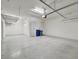 Garage with overhead storage and epoxy flooring at 4612 Stickley Ct, Palmetto, FL 34221