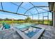 Inviting pool and spa with screened enclosure, offering a relaxing outdoor oasis at 4612 Stickley Ct, Palmetto, FL 34221