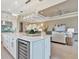 Elegant kitchen with quartz countertops and built in wine fridge at 4612 Stickley Ct, Palmetto, FL 34221