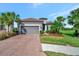 One-story home with a gray garage door and a manicured lawn at 4612 Stickley Ct, Palmetto, FL 34221