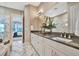Elegant bathroom with double vanity and marble floors at 4612 Stickley Ct, Palmetto, FL 34221