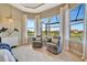 Relaxing sitting area in the main bedroom, overlooking the pool at 4612 Stickley Ct, Palmetto, FL 34221