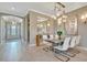 Elegant dining room with chandelier and view to entryway at 4612 Stickley Ct, Palmetto, FL 34221