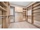 Spacious walk-in closet with ample shelving and rods at 4612 Stickley Ct, Palmetto, FL 34221