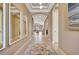 Elegant entryway with tile flooring and statement mirrors at 4612 Stickley Ct, Palmetto, FL 34221