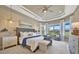 Spacious main bedroom with large windows and a cozy sitting area at 4612 Stickley Ct, Palmetto, FL 34221