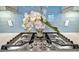 Stainless steel gas cooktop with white orchids at 4612 Stickley Ct, Palmetto, FL 34221
