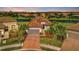 Luxury home with a tile roof and nicely landscaped yard at 4612 Stickley Ct, Palmetto, FL 34221