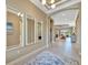 Bright entryway with tile floors and large mirrors at 4612 Stickley Ct, Palmetto, FL 34221