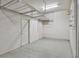 Garage with overhead storage and epoxy flooring at 4612 Stickley Ct, Palmetto, FL 34221