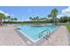 Community pool with surrounding palm trees at 4708 Sabal Key Dr, Bradenton, FL 34203