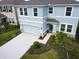 Two-story house with light blue exterior and two-car garage at 5262 Grove Mill Loop, Lakewood Ranch, FL 34211