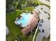 Aerial view of resort-style pool with adjacent cabana and ample parking at 5262 Grove Mill Loop, Lakewood Ranch, FL 34211