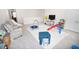 Fun playroom with a trampoline, slide, and toys at 5262 Grove Mill Loop, Lakewood Ranch, FL 34211