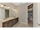 Bathroom with double vanity and view into bedroom at 5364 Salcano St, Sarasota, FL 34238