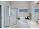 Spa-like bathroom featuring a large shower and a corner tub at 5370 Hyland Hills Ave # 2726, Sarasota, FL 34241