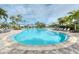 Large freeform resort-style pool with plenty of lounge chairs at 5460 Lampiasi St, Sarasota, FL 34238