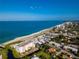 Aerial view of beach, ocean, and residential buildings at 601 Sheridan Dr, Venice, FL 34293