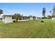 Large backyard with spacious grassy area at 601 Sheridan Dr, Venice, FL 34293