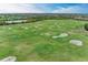 Aerial view of a lush driving range at 7374 Divot Loop, Bradenton, FL 34202