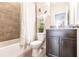 Simple bathroom with shower/tub combo and granite vanity at 8256 Enclave Way # 101, Sarasota, FL 34243